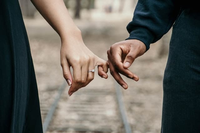 Faith Based Couple Holding Hands